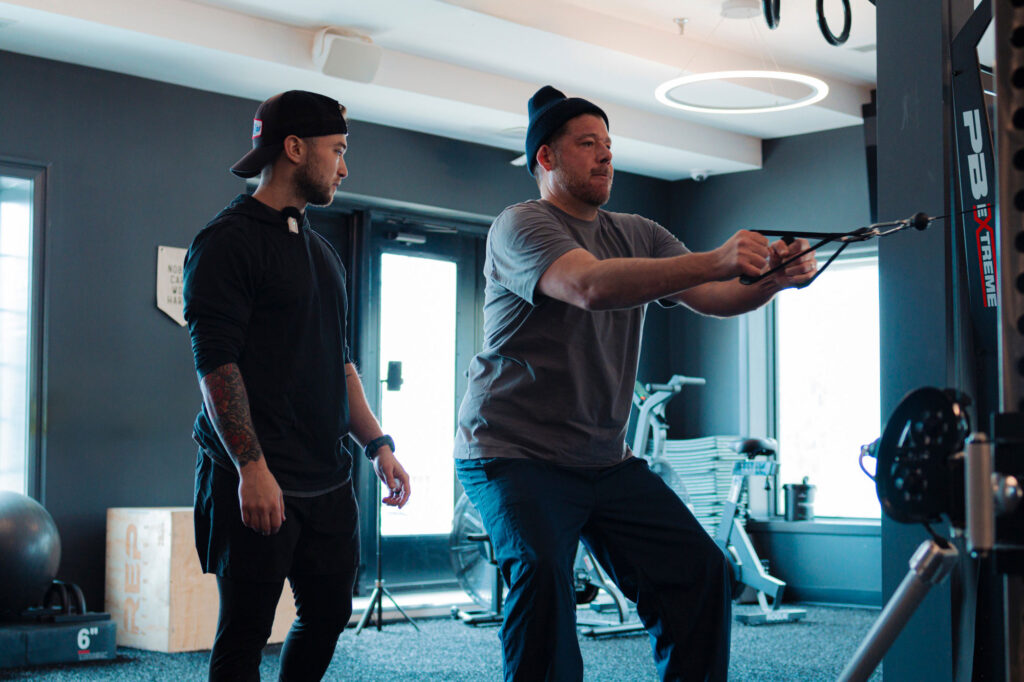 Joseph Rivieccio Helping a Client with an Exercise