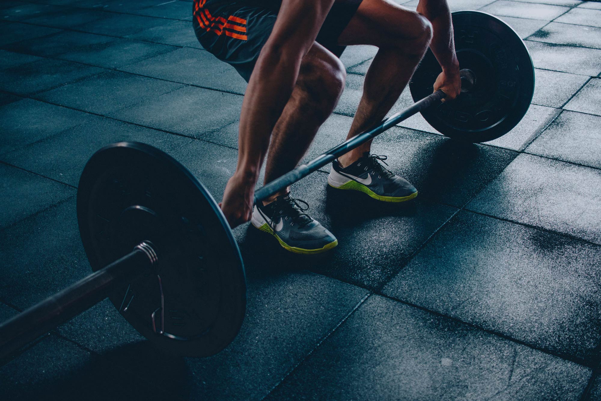 Man Lifting Weights in Gym