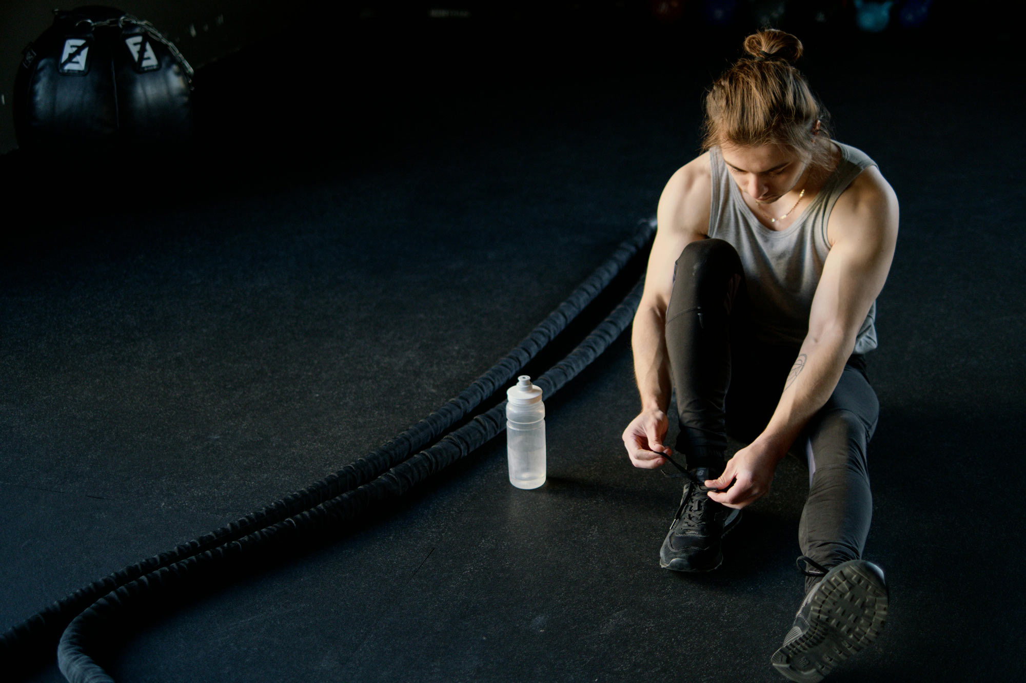 Man Tying His Shoes Getting Ready for a Workout