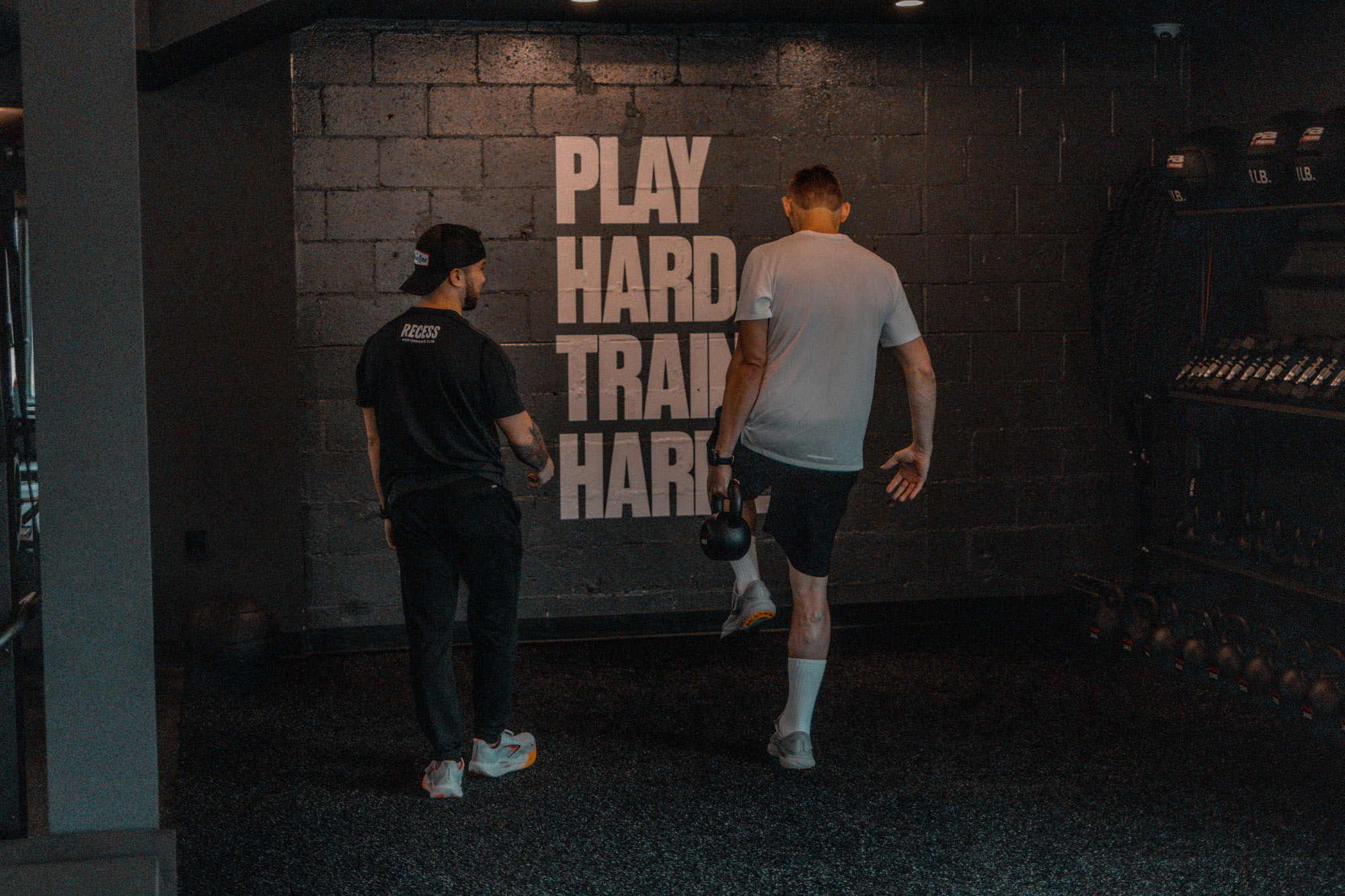 Two Men in a Gym Exercising