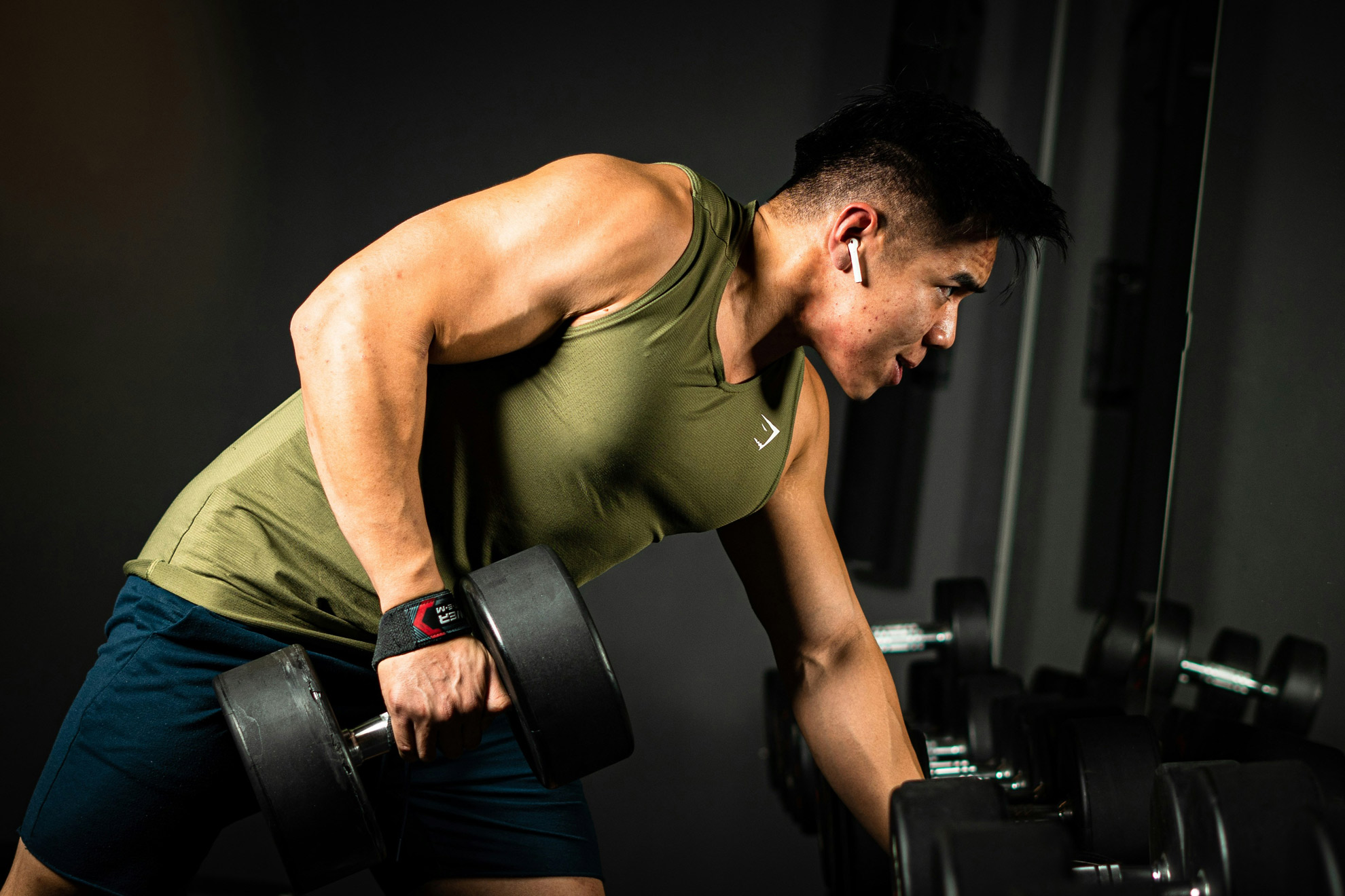Man Lifting Weights in Gym